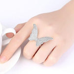 big butterfly ring on finger