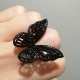 black butterfly ring on hand