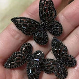 black butterfly ring set on hand