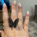 black butterfly ring set on finger