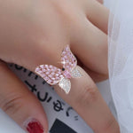 blinged out butterfly pink ring on finger