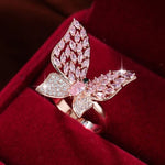 blinged out butterfly pink ring on box