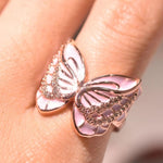 enamel butterfly ring on finger