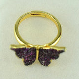 gold and purple butterfly ring upside down