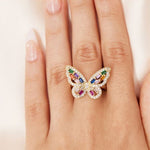 gold monarch butterfly ring on finger