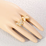 mother of pearl butterfly ring yellow on finger