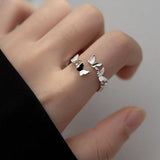 platinum butterfly ring on finger