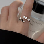 platinum butterfly ring on hand