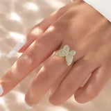 woman gold butterfly ring on finger